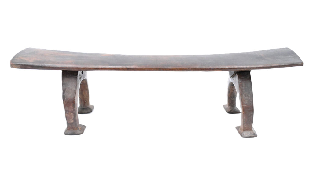 long wooden headrest with four legs