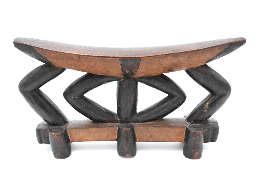 Wooden headrest with light top and bottom and dark bracing between