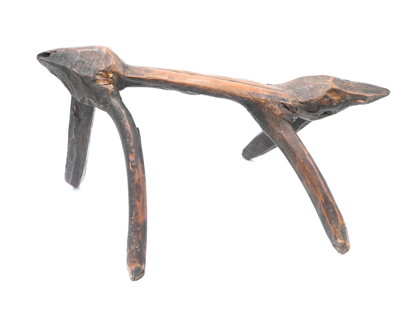 Crooked wooden headrest with four legs