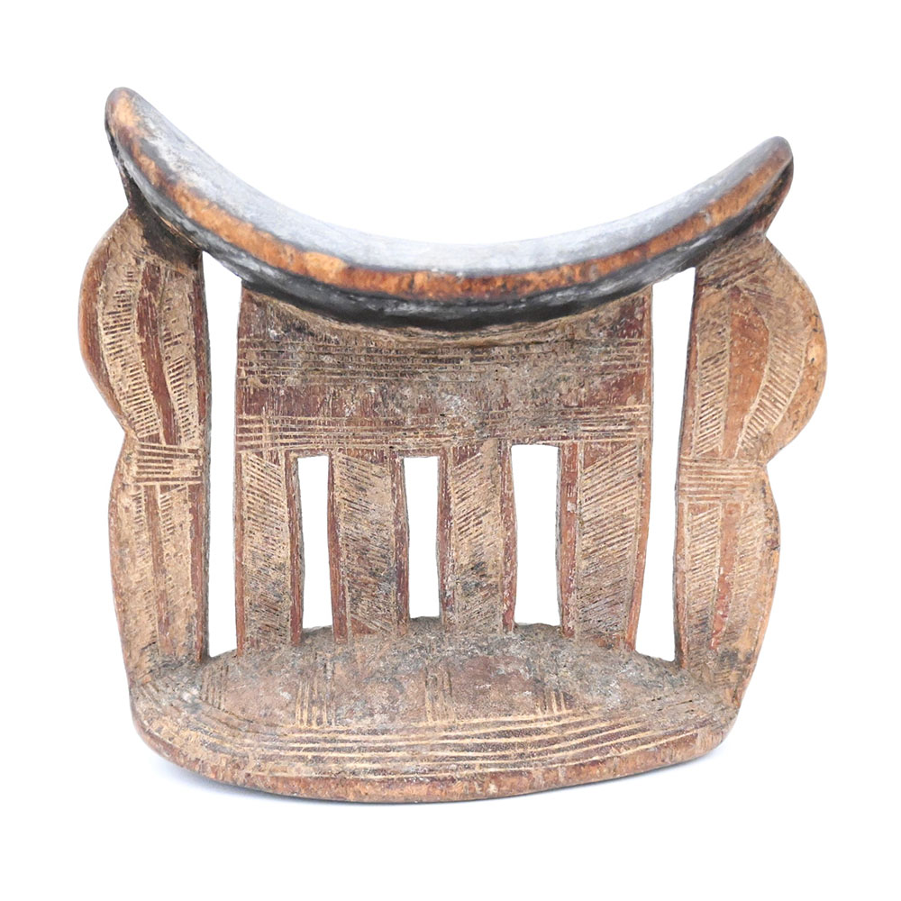 wooden headrest with 6 vertical supports connected to base