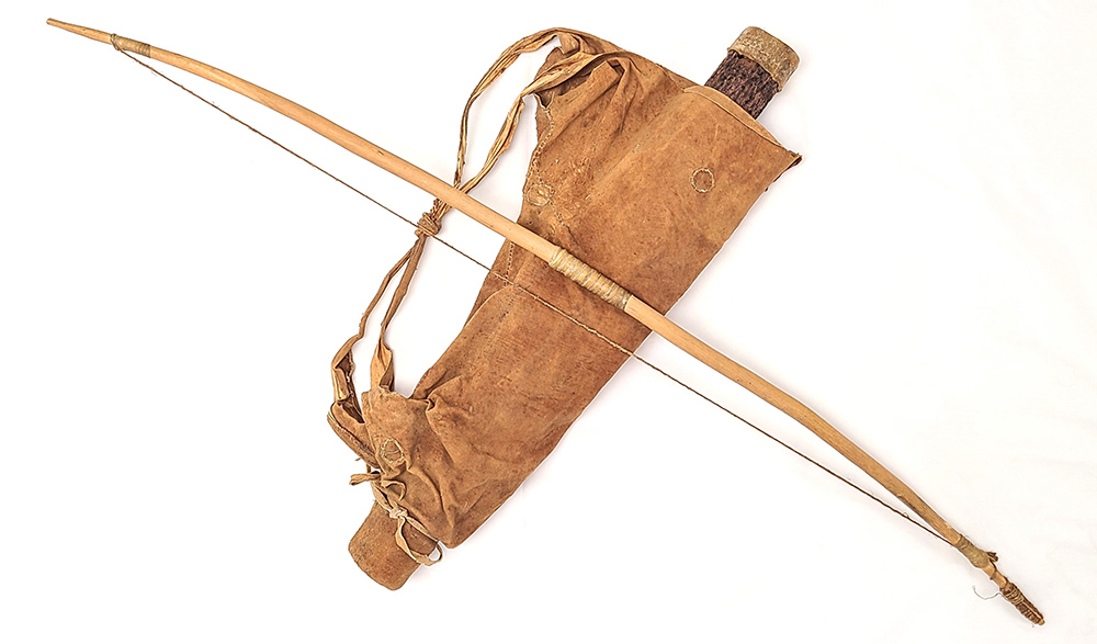 wooden bow and leather bag holding quiver