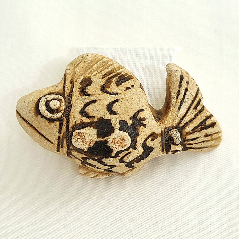 A small ceramic fish