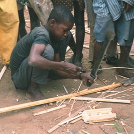 Boy carving wood