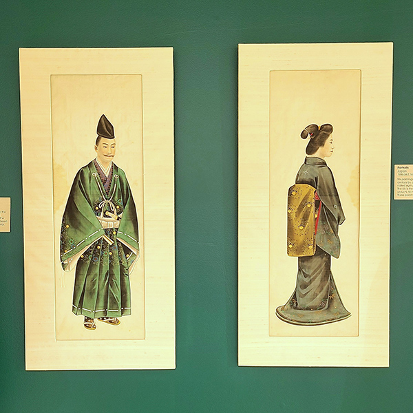 Silk portraits of a man and woman in traditional Japanese clothing